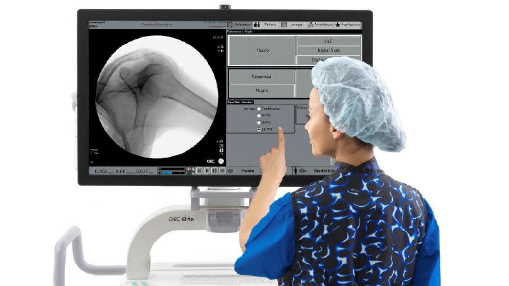 Clinician standing in front of screen