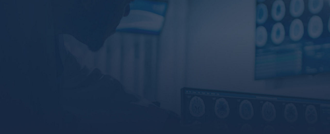 Medical professional observing brain scans