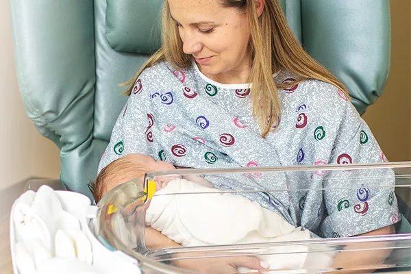 Woman holding newborn baby