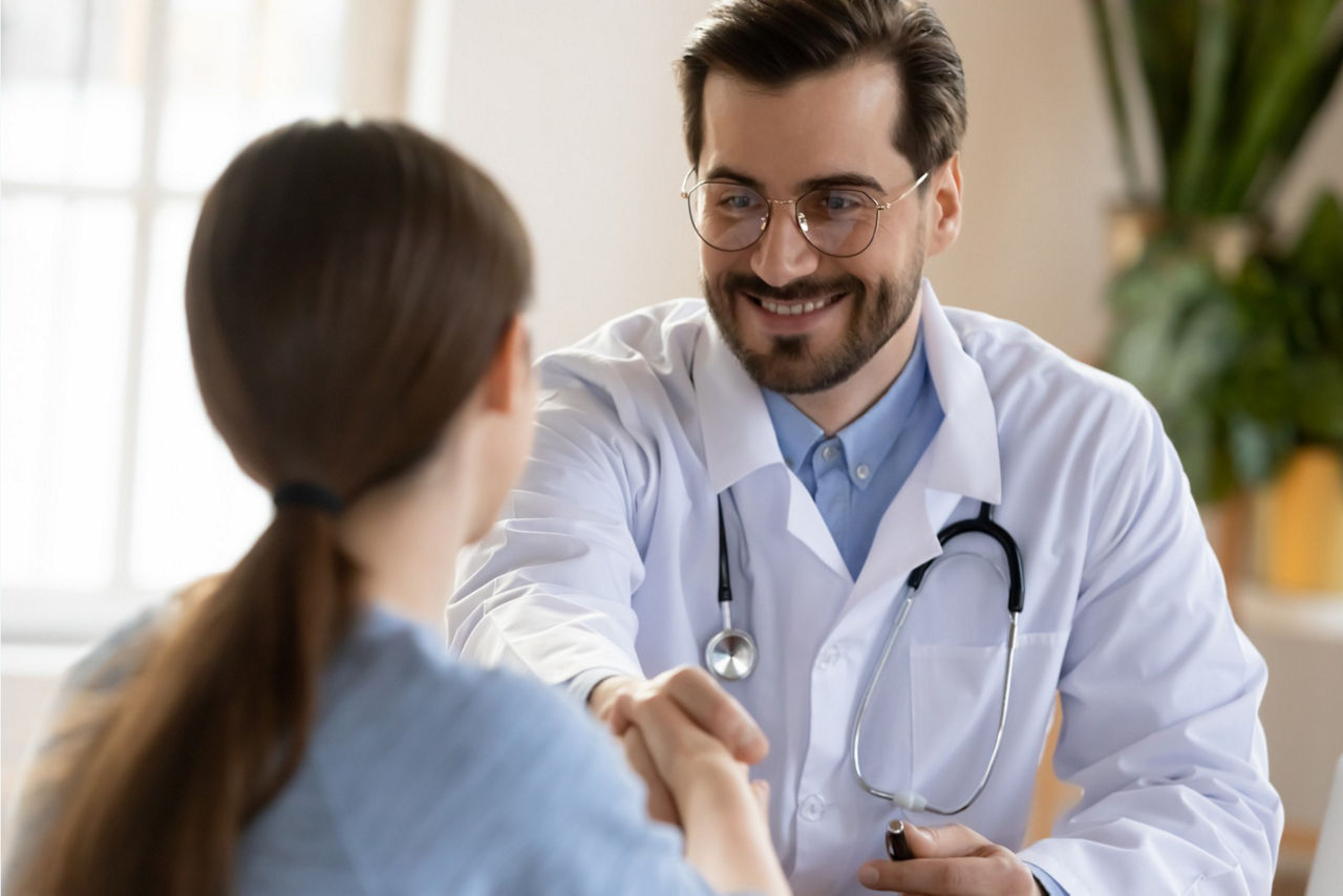close up of male clinician shaking hands