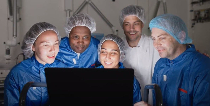 A group of healthcare professionals awaiting the results of tracer production