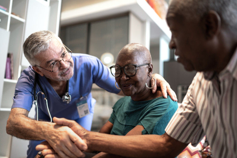 Close up of a patient's arm wearing a blood pressure cuff