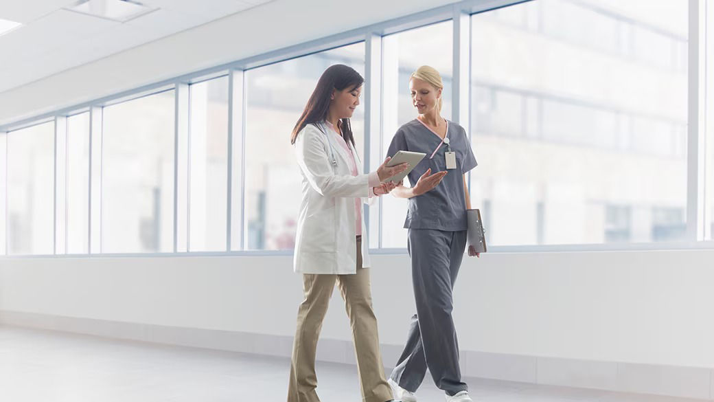 Clinicians working in a hallway. 