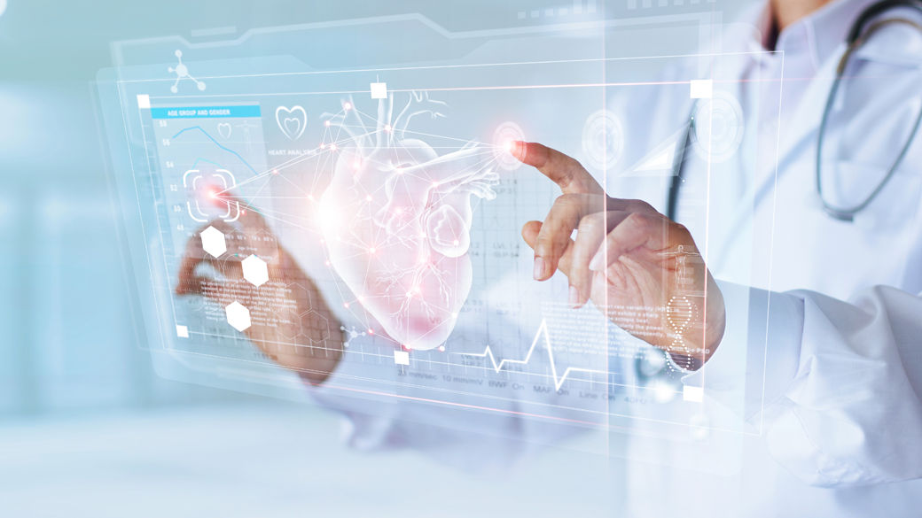 doctor manipulating virtual desktop with heart image