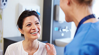 Smiling person looking at a clinician