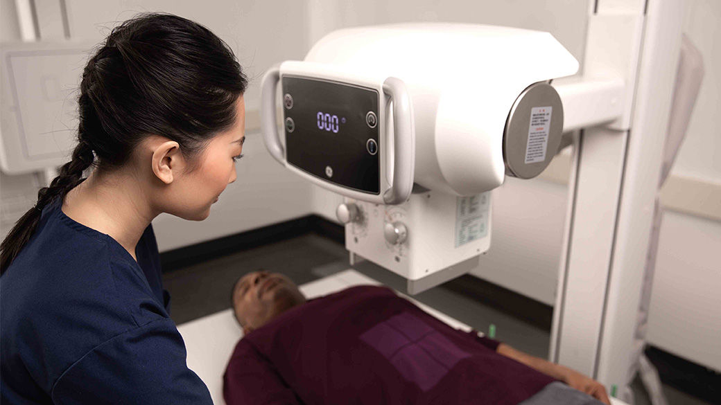 Clinician using an x-ray on a patient