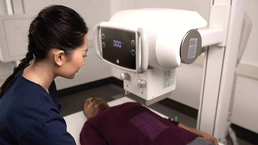 Clinician using an x-ray on a patient