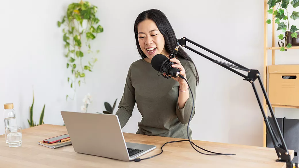 A woman podcasting