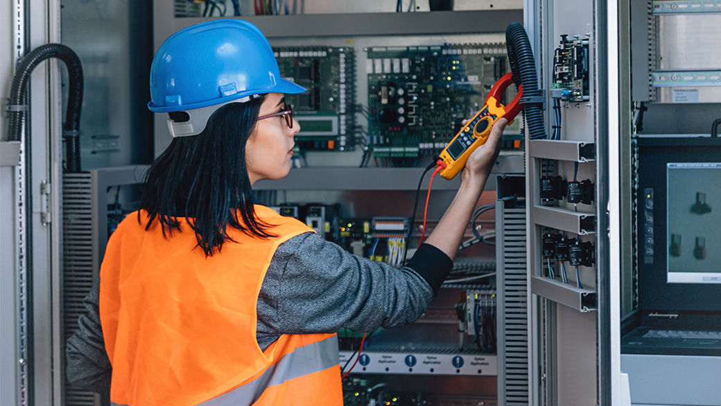 A technician working on a piece of equipment