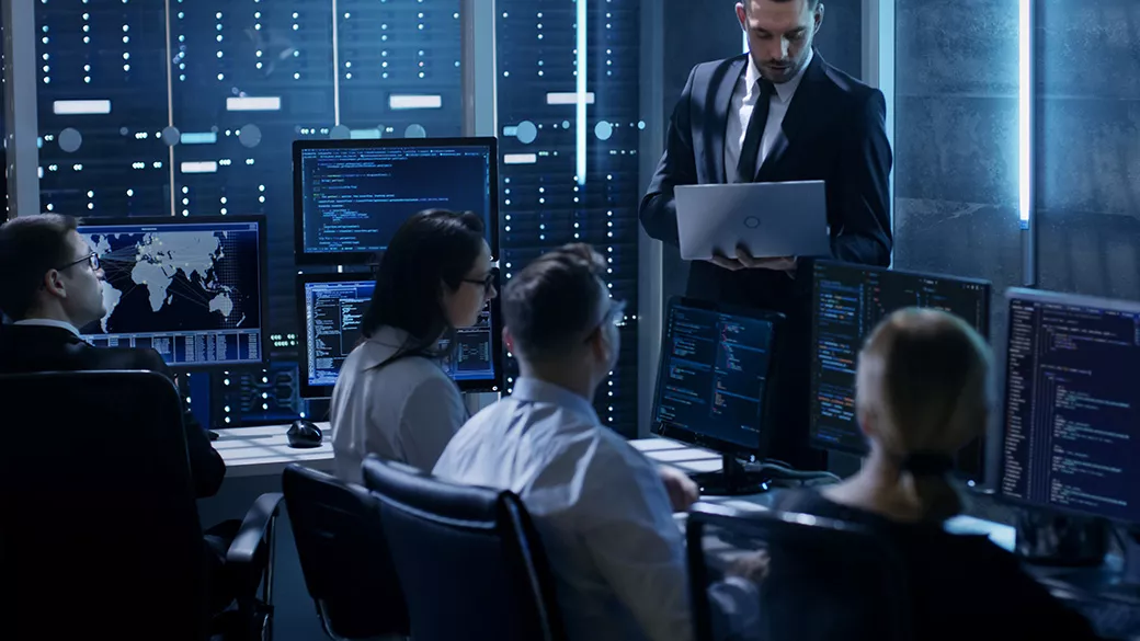 Computer technicians work in a room.