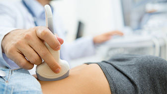 Closeup photo of a clinician giving an ultrasound