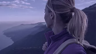 Woman with a ponytail on a mountain