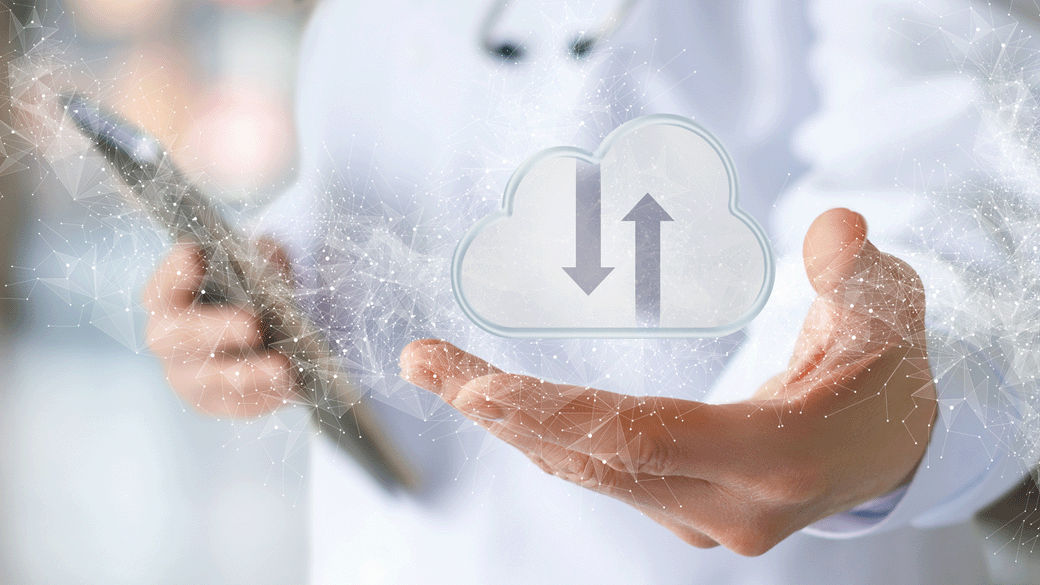 clinician with tablet with cloud graphic overlay