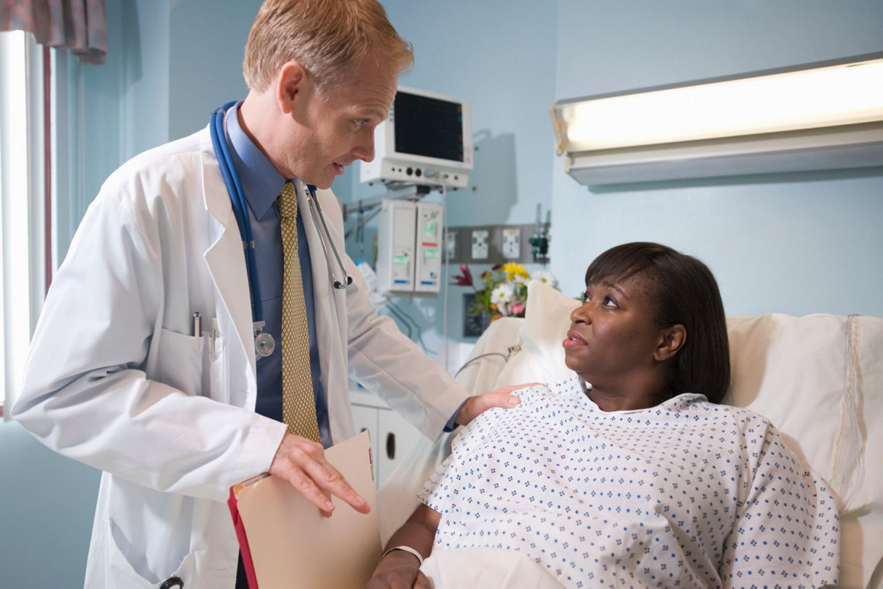 Doctor talking to high risk pateint about Visipaque safety usage