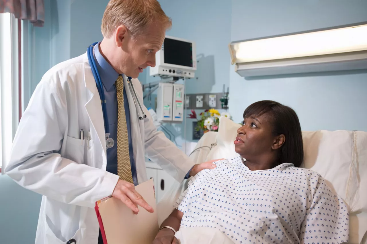 Doctor talking to high risk pateint about Visipaque safety usage