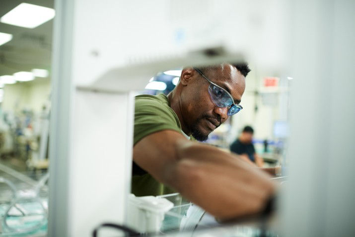 man working on a circuit board