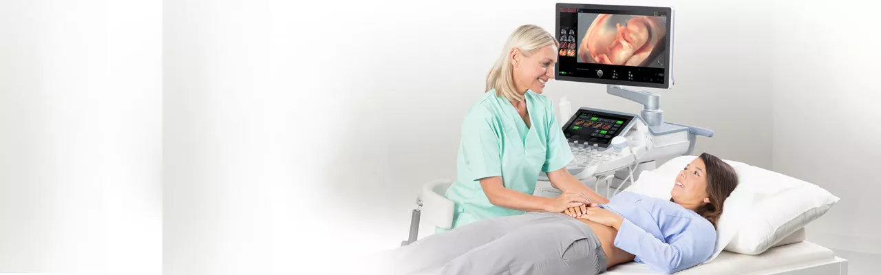 Sonographer using ViewPoint 6 reporting software for obstetrics and gynecology