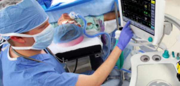 anesthetician using anesthesiology device to care for patient