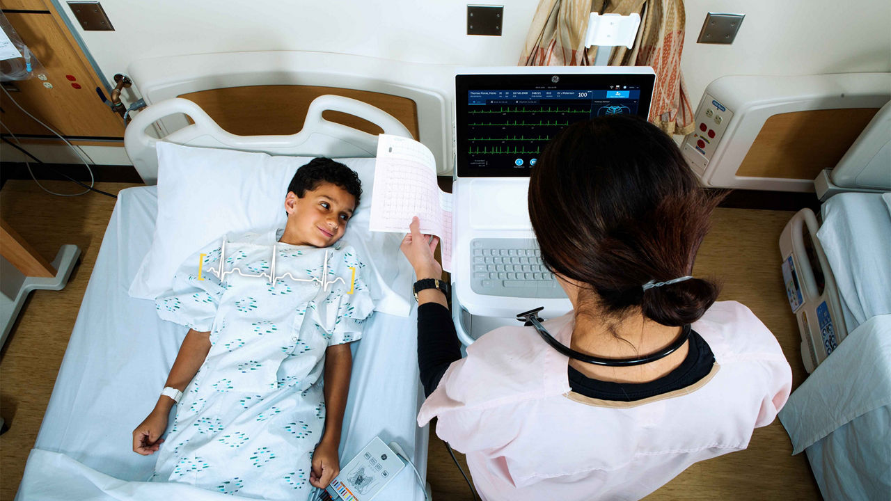 Clinician treating a pediatric patient.