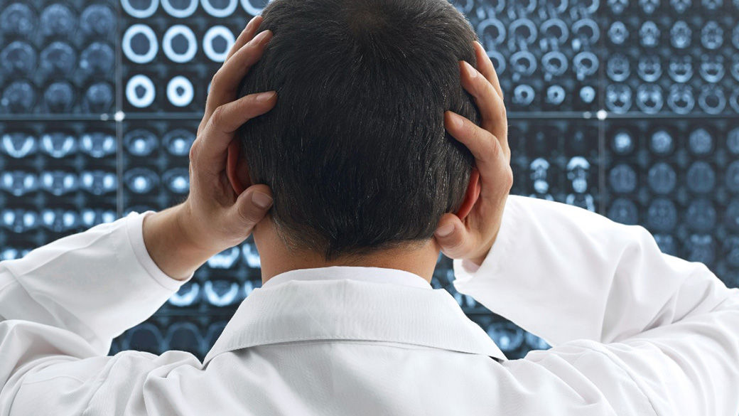 A person with their hands on their head