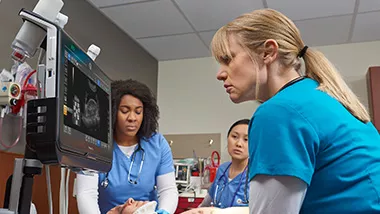 Three doctors working on an emergency patient using Venue