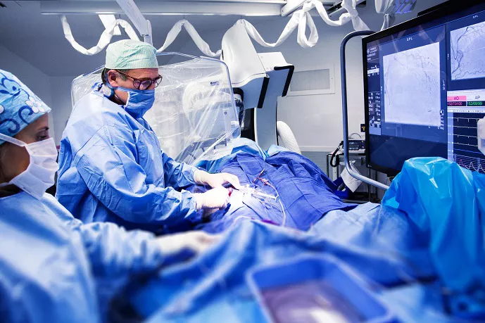 Doctor examining high risk patient