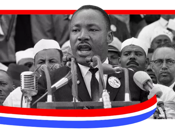 A photograph of Martin Luther King Jr. giving a speech with a red, white, and blue border.