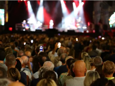 A crowd with their cameras out taking videos and pictures