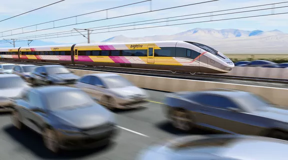 A digital rendering of a Brightline West train travelling along an interstate.