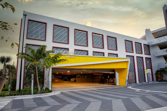 Exterior of Brightline's Boca Raton station parking garage at sundown 