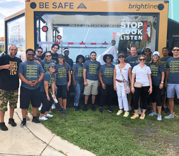 Brightline teammates and the Buzz Boxx at a community event.