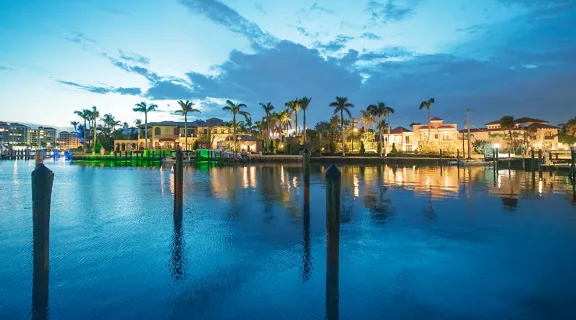 Stunning view of Boca Raton waterfront homes during twilight.