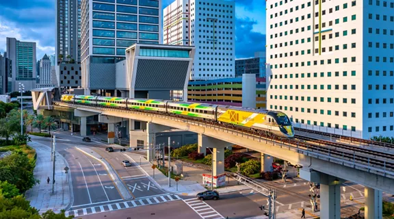 A Brightline train on the tracks outside of the Miami station