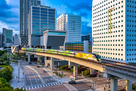 A Brightline train on the tracks outside of the Miami station