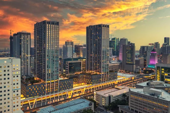 Aerial view of Brightline MiamiCentral Station situated in downtown Miami during a beautiful sunset.