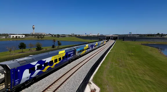 Brightline train wrapped with Princess Cruise Line promo