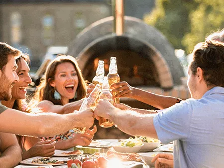 A group of friends toasting and eating