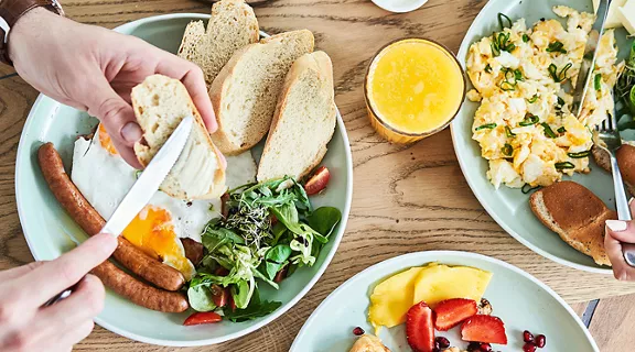A couple eating delicious food at a brunch event