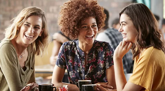 A group of friends laughing and enjoying each other's company.