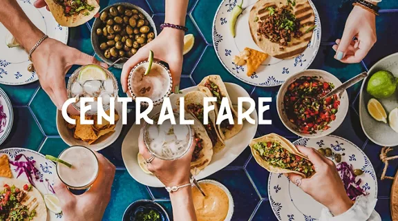Central Fare words over table with hands holding plates and glasses