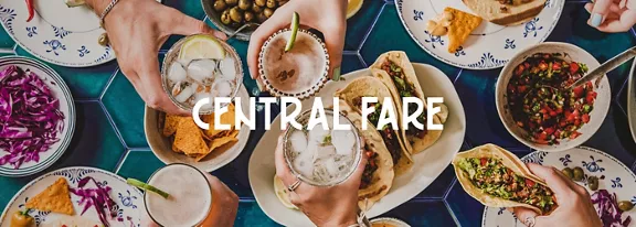 Central Fare words over table with lots of food on plates.