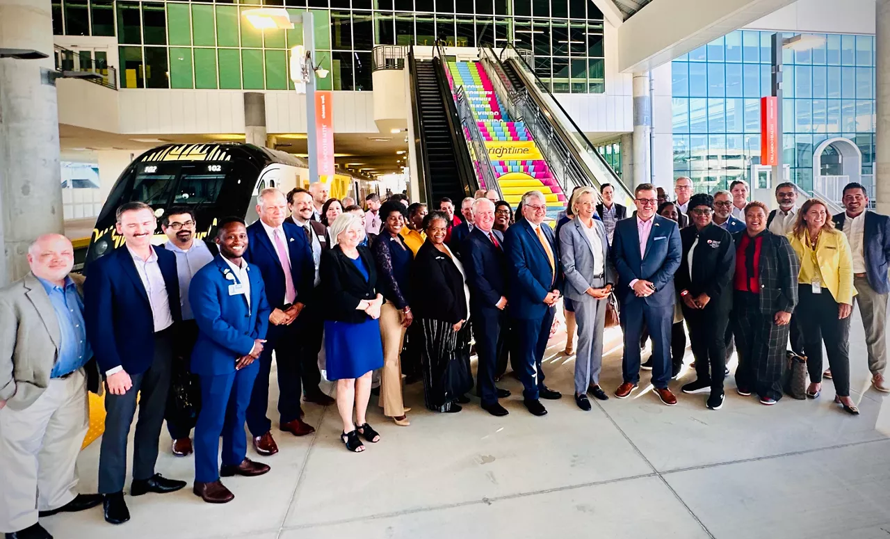 Tampa Mayor Jane Castor, members of the Tampa Bay Partnership and Tampa and Hillsborough County elected officials and business leaders posing at Brightline Orlando station