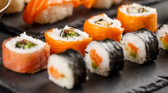 A plate of sushi and sashimi.