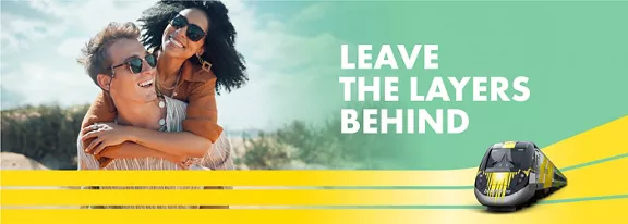 couple with sunglasses smiling with words Leave the layers behind above a image of a train