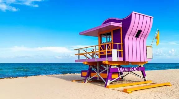 Purple lifeguard house sitting on a beach