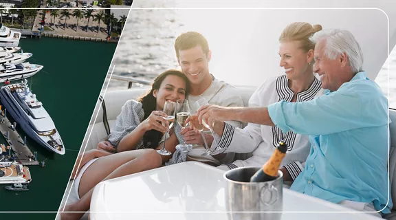 An aerial photo of boats docked in a marina. A group of friends relaxing on a boat, making a champagne toast.