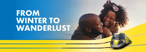 couple laughing above image of train with the words from winter to wanderlust