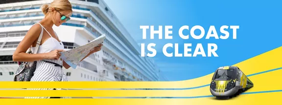 woman with sunglasses looking at map in front of a cruise ship withe the words The coast is clear above a train.