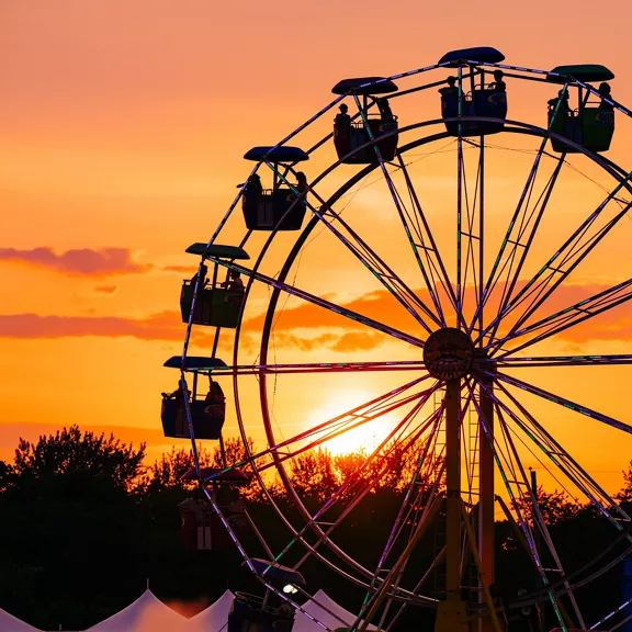A ferris wheel at dusk.