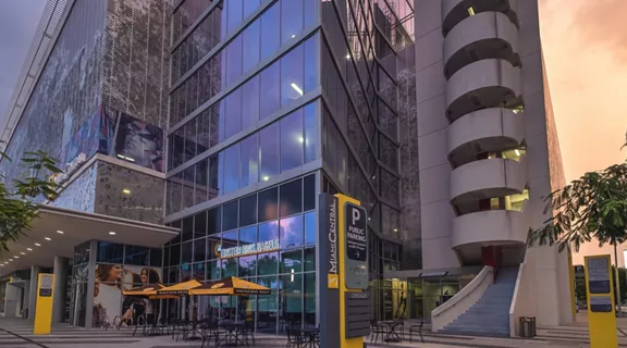 Exterior shot of a modern parking garage building with MiamiCentral Parking sign.